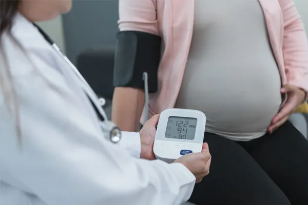 A doctor running tests on her pregnant patient