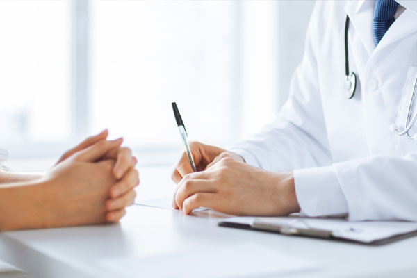 Close-up of a patient and doctor during a medical consultation.