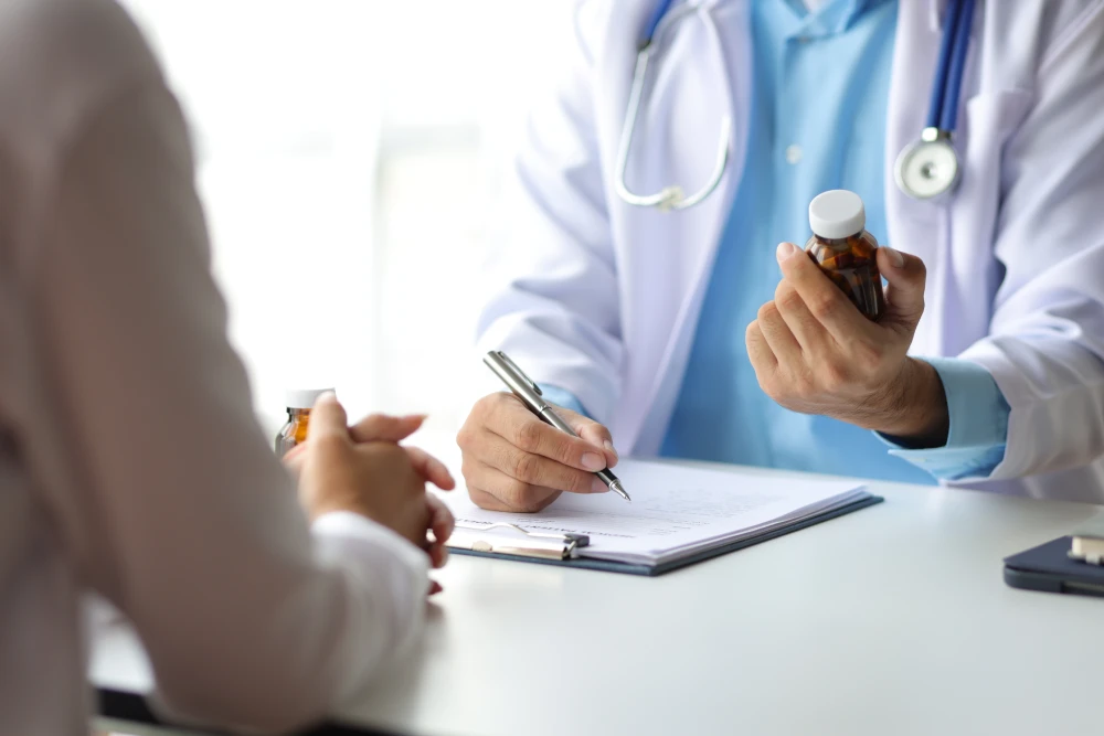 Gynaecologist in consultation with a patient about medical abortion.